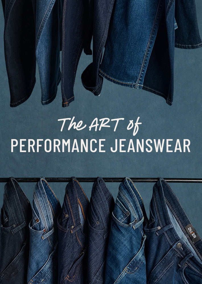 Collection of duer jeans displayed on a rack with text 'The ART of PERFORMANCE JEANSWEAR' against a dark blue background.