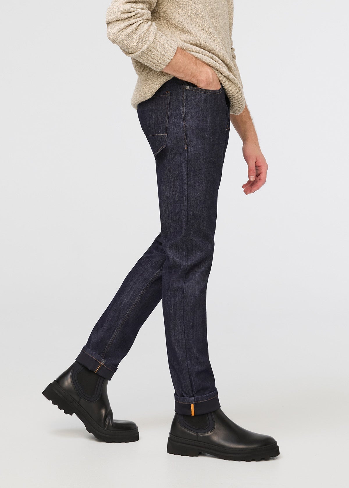 man wearing dark blue slim fit waterproof stretch jeans side