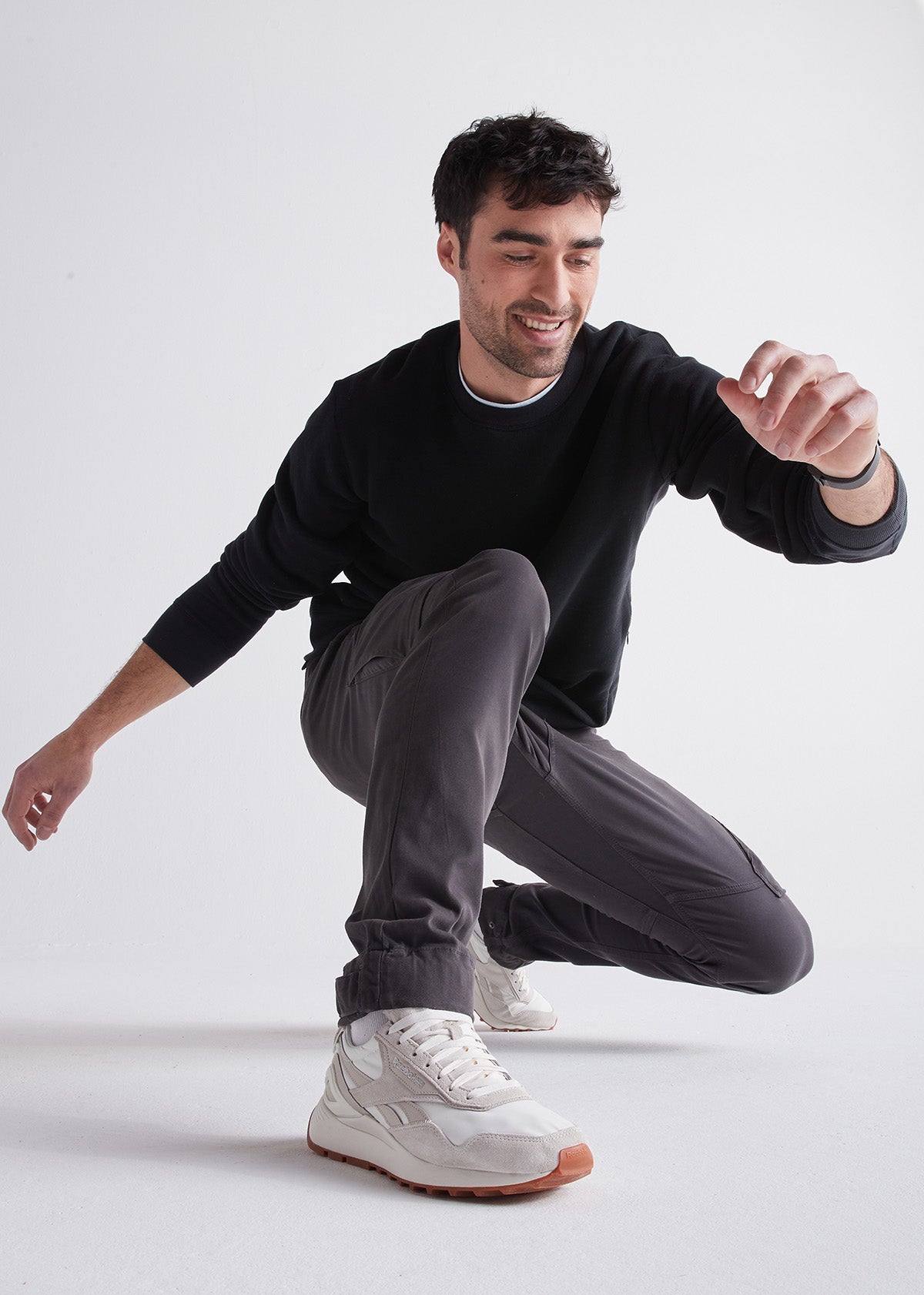 mens grey athletic waterproof pant crouching styled