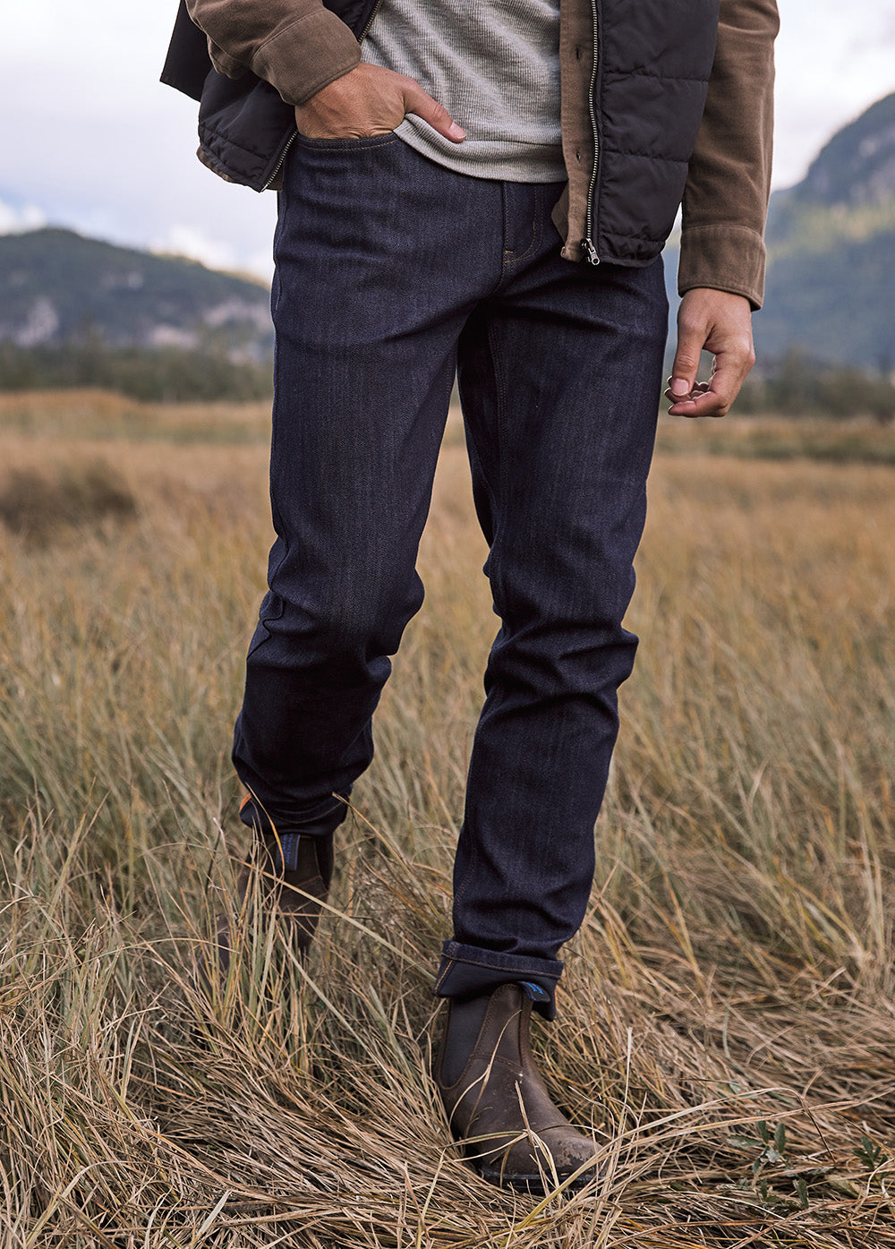 man wearing dark blue waterproof stretch jeans outdoor